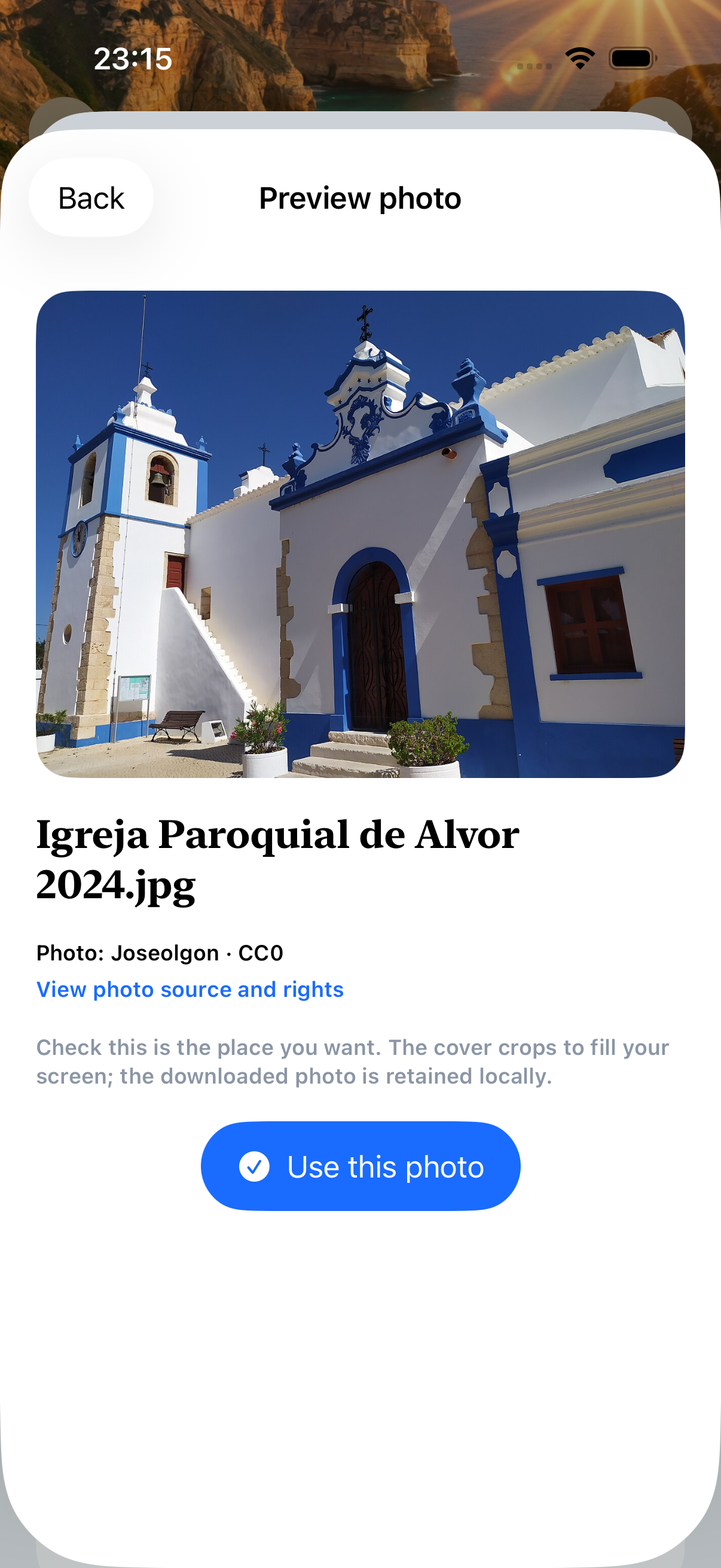 Real photo-picker preview showing the parish church in Alvor, Portugal, with source credit and Use this photo button